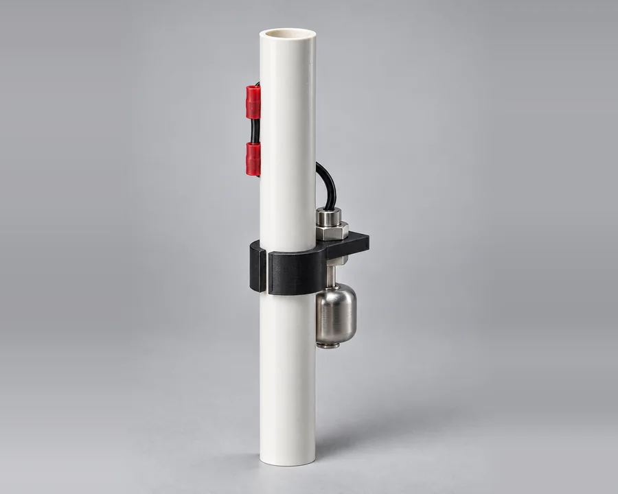 Float station: stainless float switch on a printed saddle clamped to the float rod